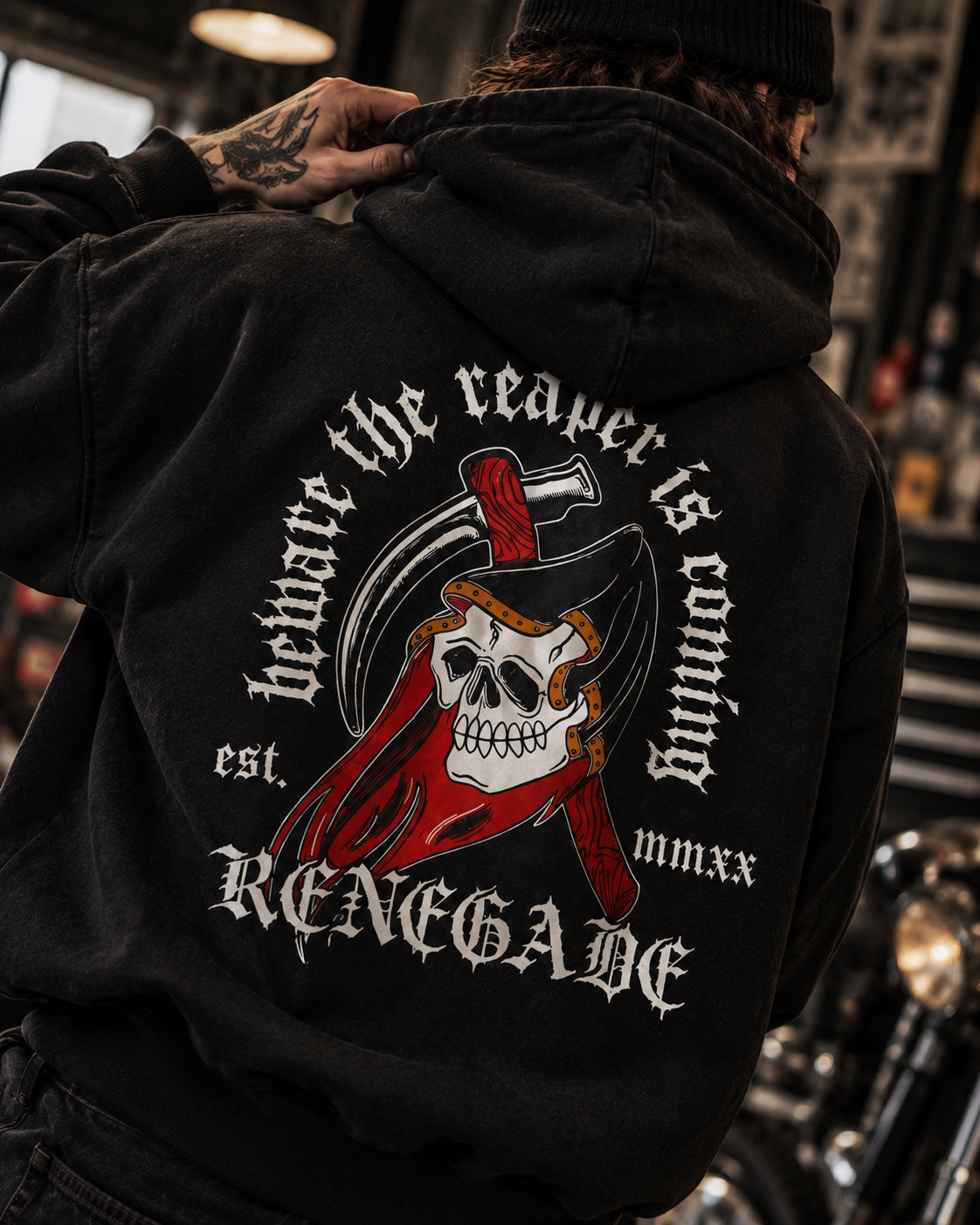 Original Renegade Reaper graphic hoodie worn in a tattoo studio — Black Friday 2026 streetwear guide