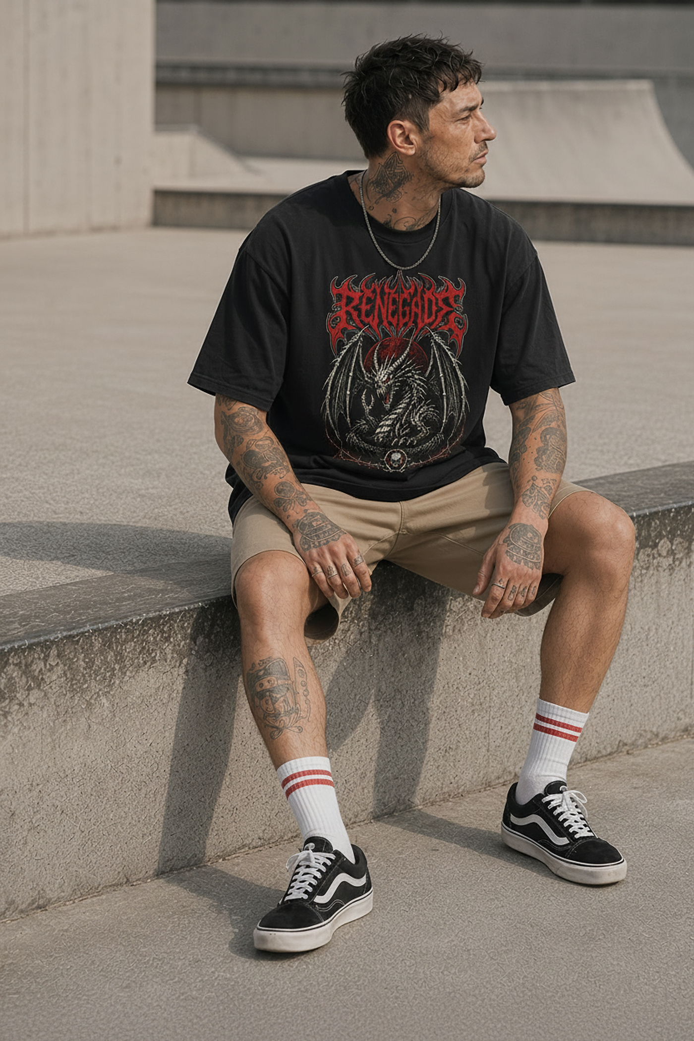 Renegade Dragon black graphic tee seated lifestyle product photo - Original Renegade