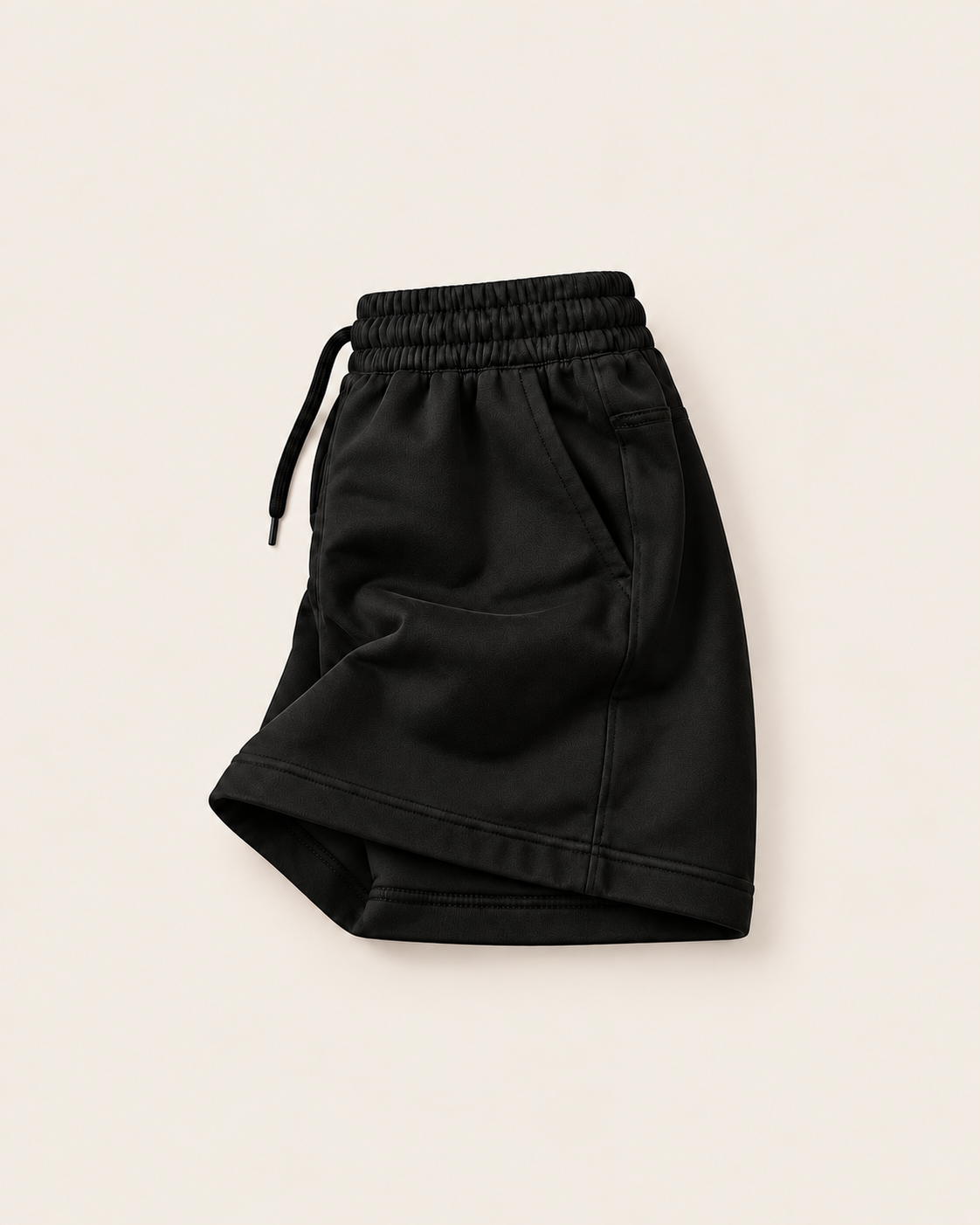 Black relaxed fit swallow shorts with mustard hem line print, left side view