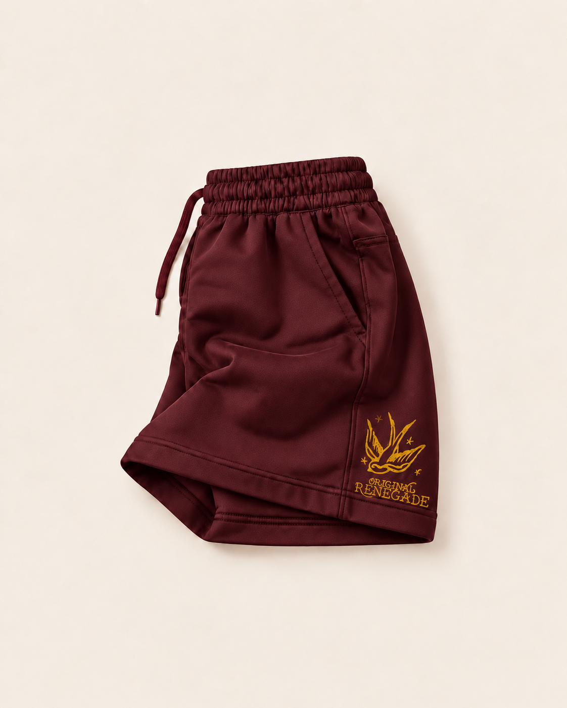 Maroon shorts with mustard swallow print on front leg, folded left side view