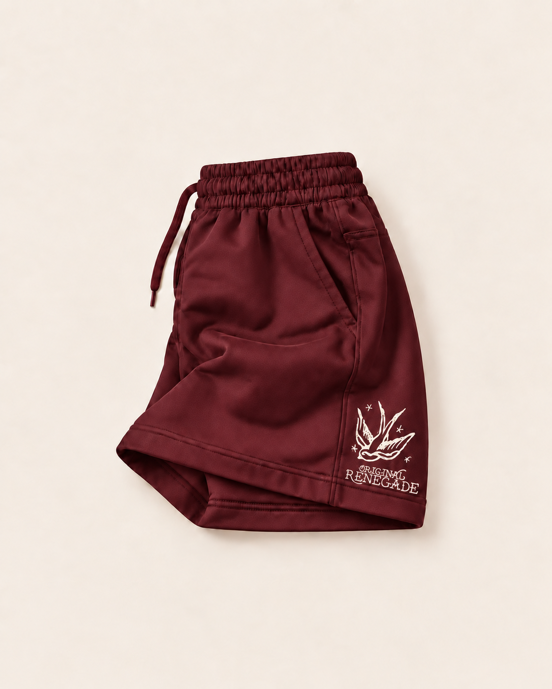 Maroon shorts with off-white swallow print on front leg, folded left side view