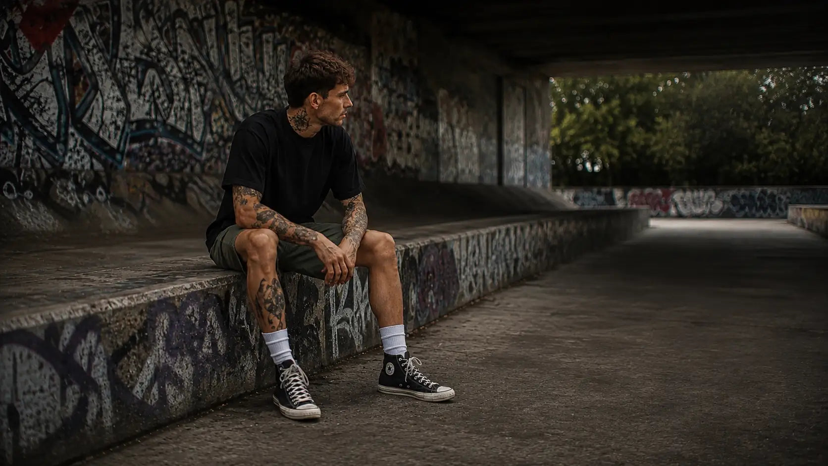 Original Renegade tattoo-inspired streetwear campaign under a graffiti-covered underpass