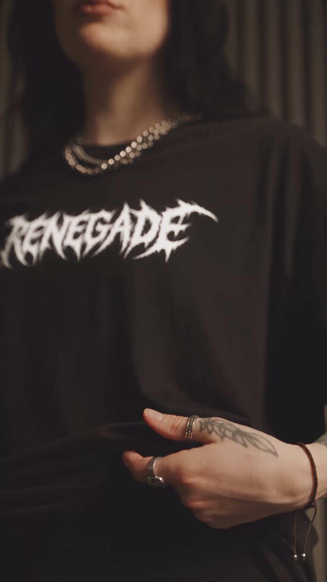 Renegade Deathcore Logo Tee — locked brunette model in the studio