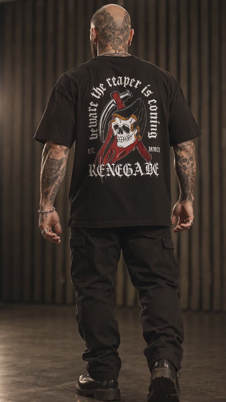The Reaper Tattoo Graphic Tee — tattooed biker model showing the large back print in the Renegade studio