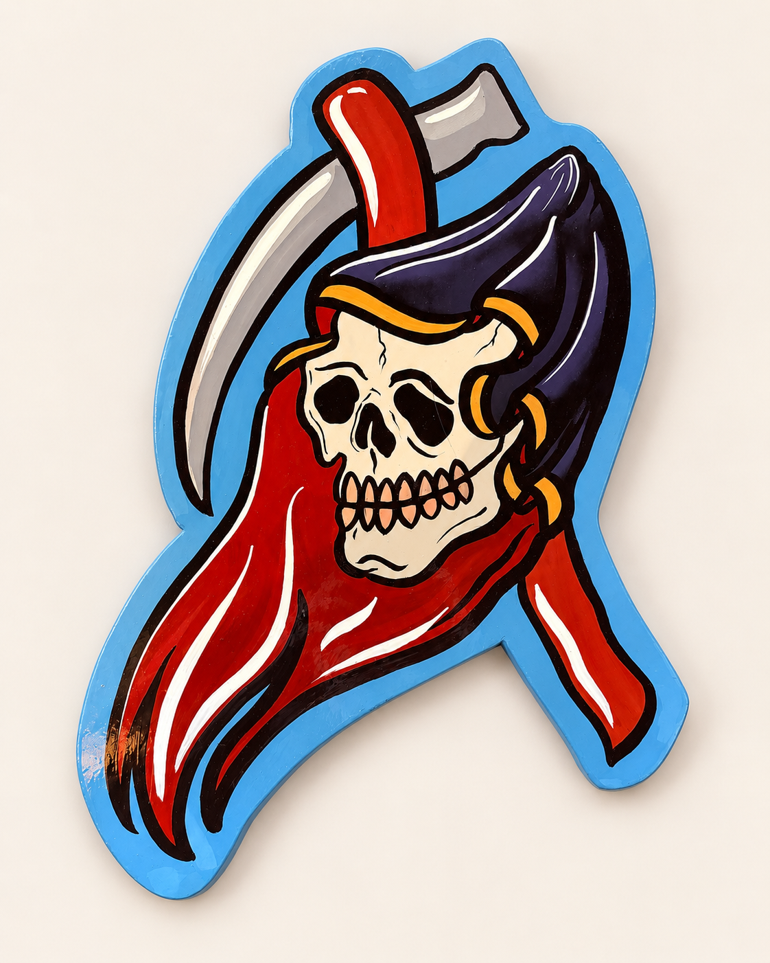 Hand-painted Reaper skull and scythe wall art on MDF, with a red cloak and blue border — overhead view