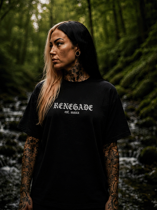 Female model wearing black Renegade gothic logo T-shirt in a woodland setting