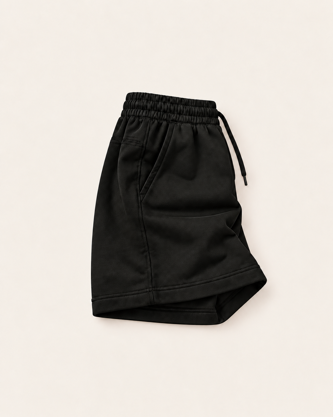 Black Renegade Relaxed Fit Shorts right side view showing the relaxed fit, pocket and open hem.